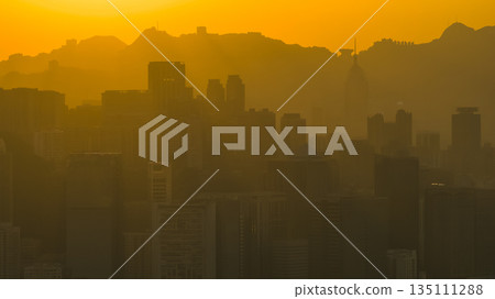 Jan 4 2026 Hong Kong Skyline Glows Under Fiery Sunset 135111288