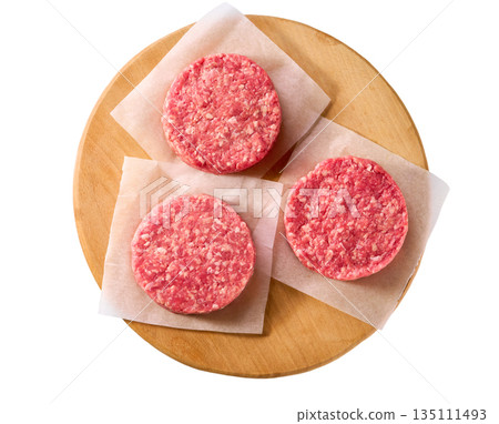 cutting board with raw ground beef patties for hamburgers isolated on white background, top view. 135111493