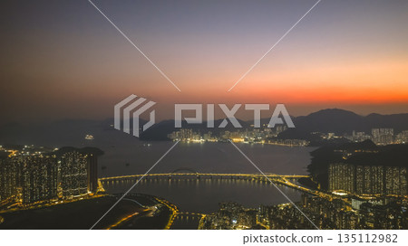 Tseung Kwan O Sunset Coastal Urban Landscape Hong Kong Jan 3 2026 Tseung Kwan O Sunset Coastal Urban Landscape Hong Kong Jan 3 2026 135112982