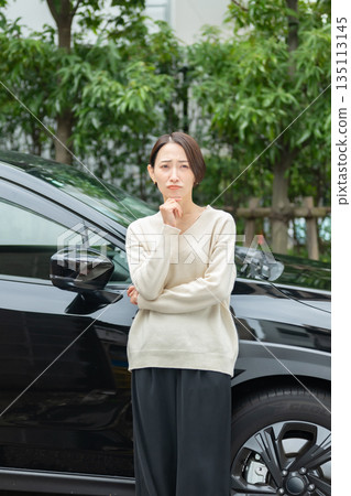 A woman suffering from car breakdown A woman suffering from car breakdown 135113145