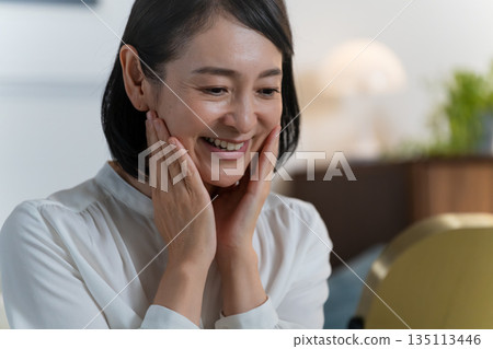 Beauty image of a middle-aged woman who takes care of her skin Beauty image of a middle-aged woman who takes care of her skin 135113446
