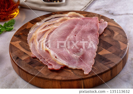 Sliced pork ham over board 135113632
