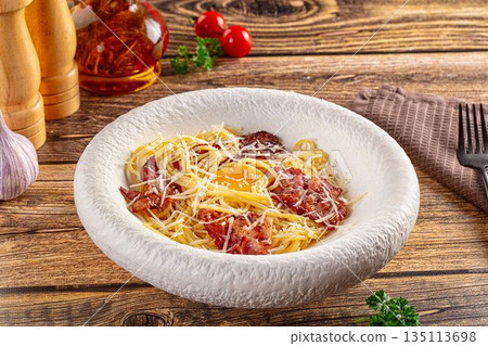 Italian classic spaghetti carbonara with bacon and egg Italian classic spaghetti carbonara with bacon and egg 135113698