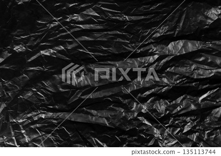 garbage bag is crumpled dark black garbage bag is crumpled dark black 135113744