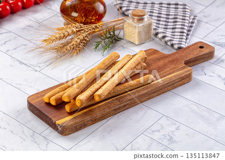 Baked Italian Grissini sticks heap 135113847