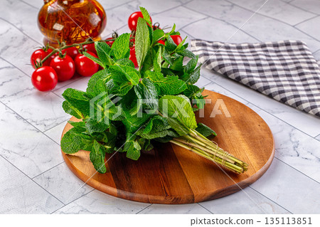 Heap of green fresh mint stems 135113851
