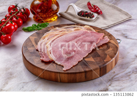 Sliced pork ham over board 135113862