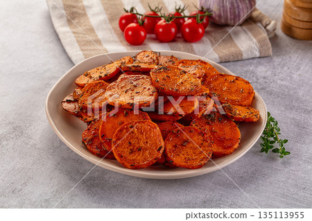 Tasty baked sweet potatoes with spices Tasty baked sweet potatoes with spices 135113955
