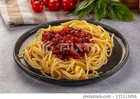 Italian pasta spaghetti bolognese with minced beef meat and tomato sauce 135113956