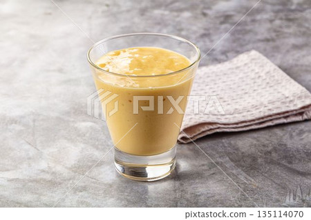 Sweet mango smoothie dessert glass 135114070