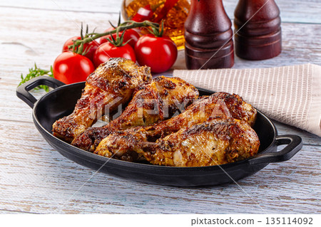 Baked chicken drumsticks with spices 135114092