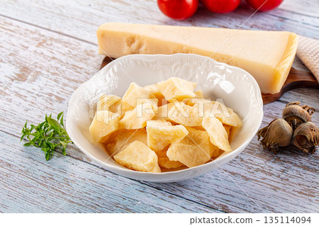 Parmesan cheese pieces in the bowl Parmesan cheese pieces in the bowl 135114094
