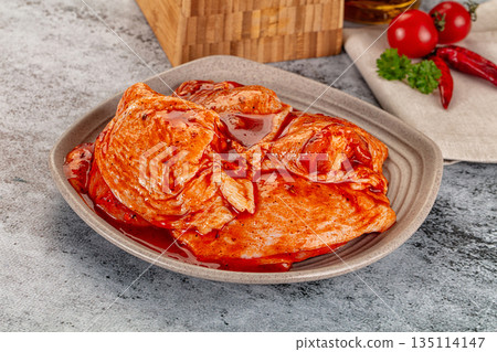 Raw chicken marinated thighs with skin Raw chicken marinated thighs with skin 135114147