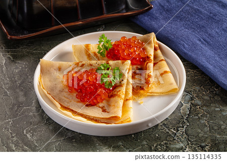 Russain traditional pancakes with red caviar 135114335