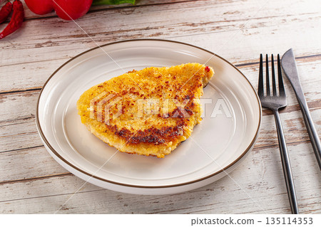 Breaded crispy chicken schnitzel 135114353