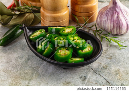 Hot spicy sliced jalapeno pepper Hot spicy sliced jalapeno pepper 135114363