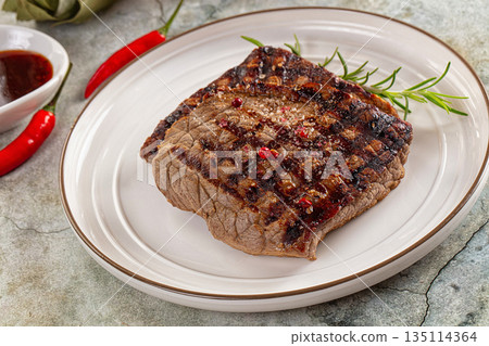 Grilled juicy beef steak with pepper 135114364