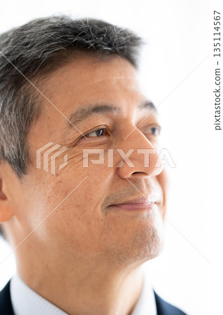 A manager with a confident and hopeful expression A manager with a confident and hopeful expression 135114567