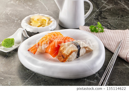 Japanese cuisine - sushi with eel, salmon and prawn Japanese cuisine - sushi with eel, salmon and prawn 135114622