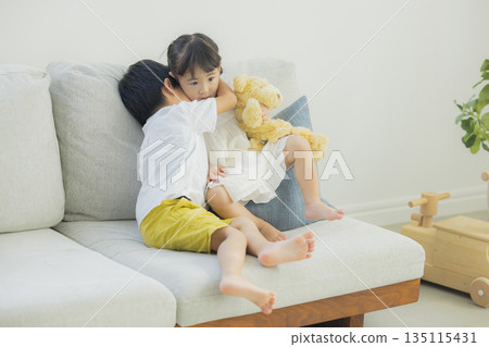 Children playing in the living room Children playing in the living room 135115431