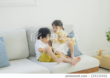 Children playing in the living room Children playing in the living room 135115432