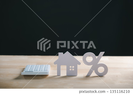 Home property real estate mortgage interest rate percent calculation shown with house model percentage sign and calculator on wood desk for financial planning Home property real estate mortgage interest rate percent calculation shown with house model percentage sign and calculator on wood desk for financial planning 135116210