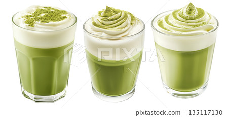 Creamy matcha latte topped with whipped cream and green tea powder in glass, isolated on a white transparent background 135117130