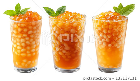 Orange bubble tea Filipino Sagot Gulaman filled with tapioca pearls and topped with mint, isolated on white background. Orange bubble tea Filipino Sagot Gulaman filled with tapioca pearls and topped with mint, isolated on white background. 135117131