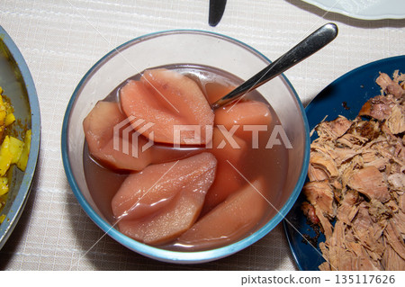 Poached pears with red wine and cinnamon Poached pears with red wine and cinnamon 135117626
