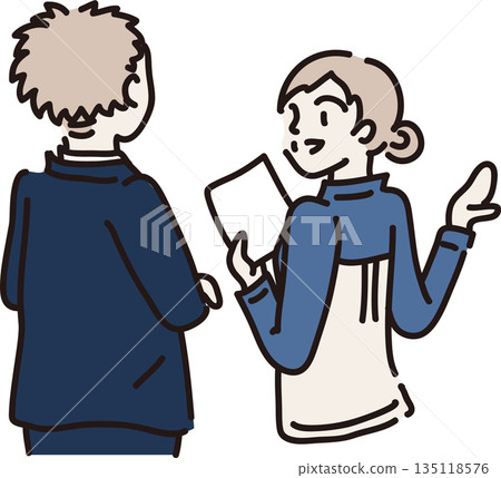 A woman in blue work clothes explaining to a visitor 135118576