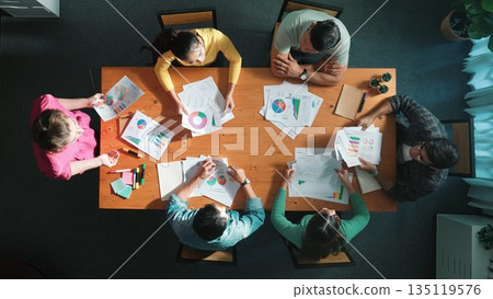 Top view of start up business team holding paper while discuss idea. Symposium. 135119576