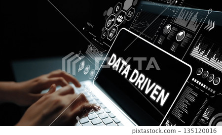 Hands Typing on Laptop with Data Driven Graphics and Analytics Representations in Dark Background. Asymptotic smart data analytic 135120016