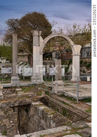 Ancient Agora of Smyrna ruins with columns and archway, Izmir, Turkey. 135120235