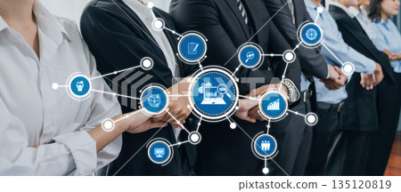 Business Professionals Collaborating in a Modern Office Setting with Technology Icons Representing Connectivity and Innovation in Team Work Environment. Amity 135120819
