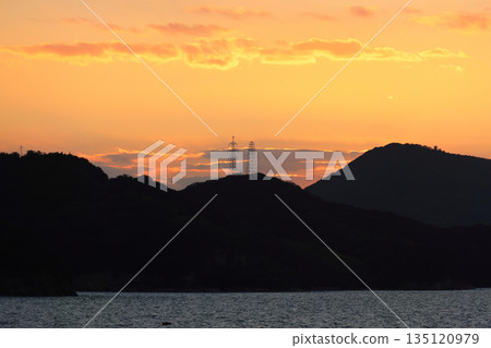 The Seto Inland Sea at dusk, the evening sky over Ko-Teshima in Bisan Seto seen from the Shodoshima Ferry 135120979