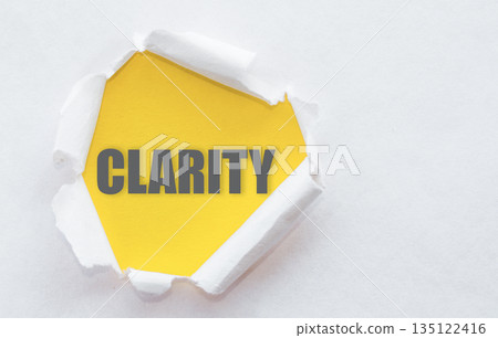 Torn Paper Revealing Yellow Background With the Word Clarity Torn Paper Revealing Yellow Background With the Word Clarity 135122416