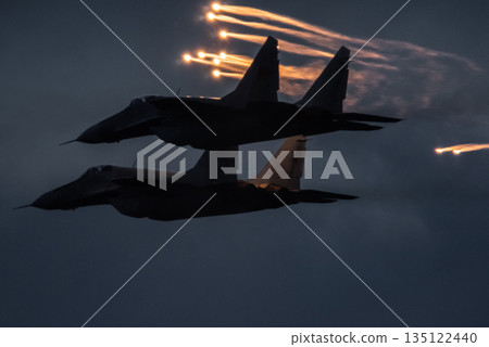 Aircraft fighter jets against the background of dark blue sky Aircraft fighter jets against the background of dark blue sky 135122440