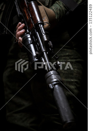Photo shoot of russia soldier holding machine gun in hands. Man is wearing military uniform. Photo shoot of russia soldier holding machine gun in hands. Man is wearing military uniform. 135122489