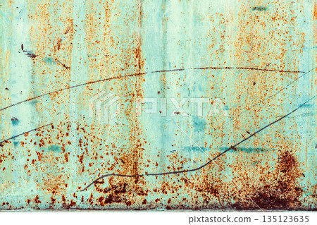 Rusty Turquoise Metal Texture. Turquoise painted metal wall with heavy rust spots, scratches, corrosion marks across surface. Natural texture used as background, backdrop, mockup for industrial design 135123635