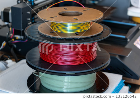 Spool of yellow pla filament for printing 3d printer Spool of yellow pla filament for printing 3d printer 135126542