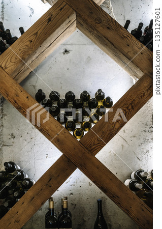 Modern Wine Cellar Display with Wooden Grid and Backlighting 135127601