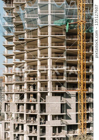 Construction of a building. Construction site with crane. Business, development, industry. Construction of a building. Construction site with crane. Business, development, industry. 135127607