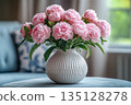 Lush Bouquet of Pink Peonies on a Velvet Table in Interior 135128278