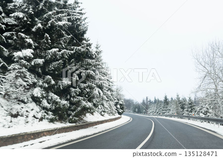 Winter road and snow with landscape of trees with frost Winter road and snow with landscape of trees with frost 135128471