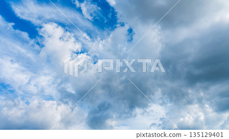 Many white clouds flowing in the summer blue sky 135129401