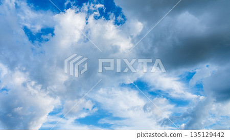Many white clouds flowing in the summer blue sky Many white clouds flowing in the summer blue sky 135129442