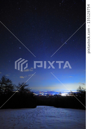 Starry sky over Nikko Kirifuri Plateau and the night view of Nikko city 135129754