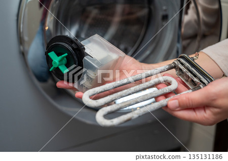 Repair and maintenance of washing machine heater and pump parts, cleaning from limescale buildup Repair and maintenance of washing machine heater and pump parts, cleaning from limescale buildup 135131186