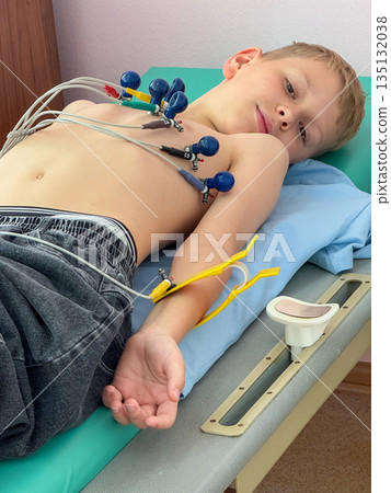 Child undergoing electrocardiogram examination in medical clinic Child undergoing electrocardiogram examination in medical clinic 135132038