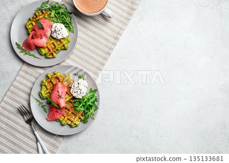Healthy breakfast with green avocado based waffles and salmon 135133681
